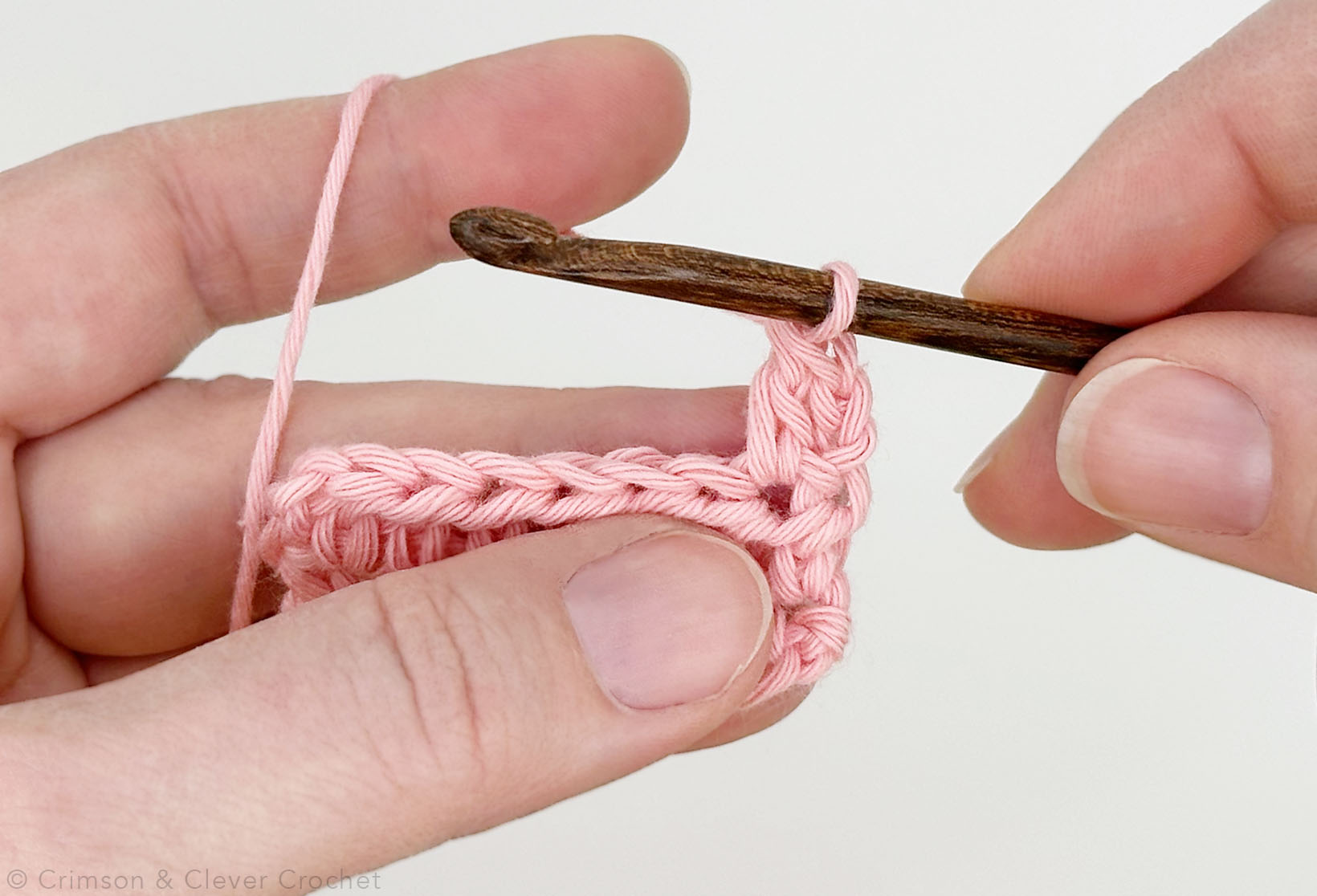 Close-up of first double crochet (dc) stitch of row 3.