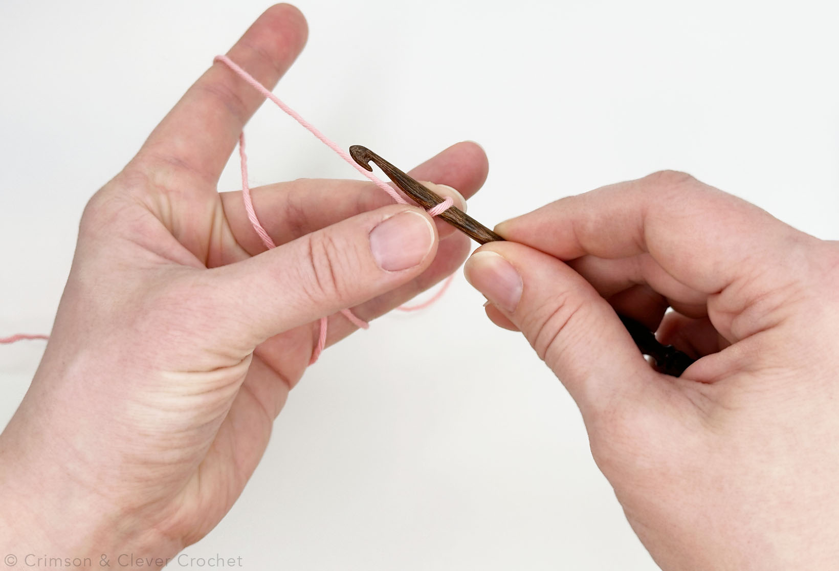 Pinch the slip knot.