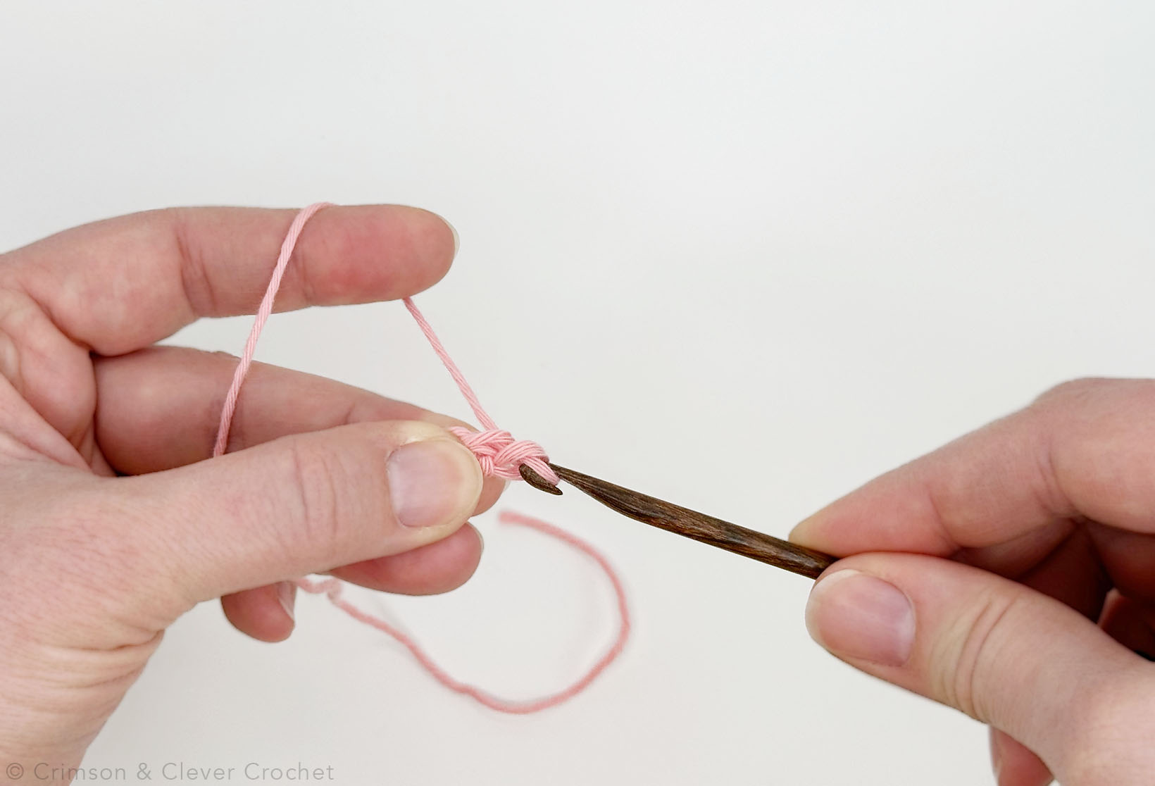Pull yarn through both loops on the hook.